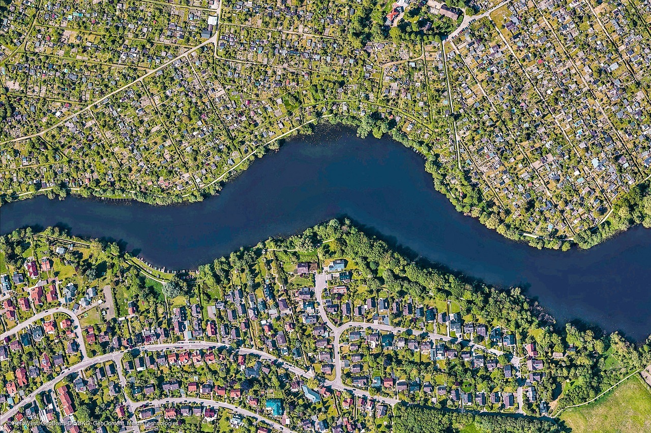 Aerial view of a large subdivisions along a river